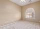 Bedroom featuring a carpeted floor, a modern ceiling fan, and a window with louvers for light control at 13657 W Holly St, Goodyear, AZ 85395