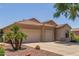 Well-maintained home boasts a spacious three-car garage and desert-friendly landscaping at 13657 W Holly St, Goodyear, AZ 85395