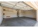 Spacious two-car garage with ample storage shelving units for organization at 13657 W Holly St, Goodyear, AZ 85395