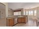 Functional kitchen featuring stainless appliances, granite countertops, and natural light at 13657 W Holly St, Goodyear, AZ 85395