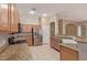 Modern kitchen with stainless steel appliances, granite countertops, and ample cabinet space at 13657 W Holly St, Goodyear, AZ 85395
