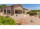 Large backyard featuring a covered patio and drought-tolerant desert landscaping at 13657 W Holly St, Goodyear, AZ 85395
