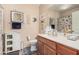 Bathroom featuring a vanity with a sink, toilet, and stylish decorations, creating a cozy atmosphere at 14575 W Mountain View Blvd # 12309, Surprise, AZ 85374