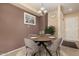 Charming dining room with a round table, four chairs, and stylish decor at 14575 W Mountain View Blvd # 12309, Surprise, AZ 85374
