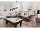 Spacious game room features a pool table, seating areas, and plenty of room for entertaining at 14575 W Mountain View Blvd # 12309, Surprise, AZ 85374
