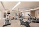Well-equipped gym with treadmills, bikes, and weights for a complete workout at 14575 W Mountain View Blvd # 12309, Surprise, AZ 85374