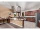 Spacious kitchen features an island, stainless steel appliances, and sleek countertops at 14575 W Mountain View Blvd # 12309, Surprise, AZ 85374