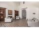 Bright living room boasts hardwood floors, a fireplace, and comfortable seating, perfect for relaxing at 14575 W Mountain View Blvd # 12309, Surprise, AZ 85374