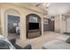 Spacious living room showcases an open floor plan leading to the bedroom, plus a TV at 14575 W Mountain View Blvd # 12309, Surprise, AZ 85374