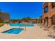 Community pool and spa surrounded by lounge chairs, offering a perfect outdoor retreat at 14575 W Mountain View Blvd # 12309, Surprise, AZ 85374