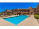 Inviting community pool with ample lounge seating and a well-maintained building exterior in the background at 14575 W Mountain View Blvd # 12309, Surprise, AZ 85374