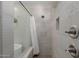 Modern bathroom with tile shower, decorative tile accent and chrome fixtures at 14759 W Alexandria Way, Surprise, AZ 85379
