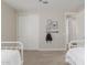 Bedroom features sliding closet doors, carpet flooring, and a light neutral wall color at 14759 W Alexandria Way, Surprise, AZ 85379