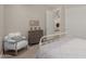 Bright bedroom featuring carpet, white trim and light neutral color palette at 14759 W Alexandria Way, Surprise, AZ 85379