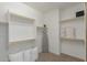 Walk-in closet with built-in shelves and a carpeted floor at 14759 W Alexandria Way, Surprise, AZ 85379