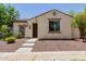 Charming single-story home with a tile roof, neutral stucco, and low-maintenance landscaping at 14759 W Alexandria Way, Surprise, AZ 85379