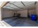 Spacious three car garage with storage rack and utility closet at 14759 W Alexandria Way, Surprise, AZ 85379