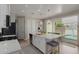 Kitchen island with a sink, stainless steel appliances, and a view of the pool at 14759 W Alexandria Way, Surprise, AZ 85379