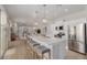 Open kitchen featuring a large island, stainless appliances and seamless access to living spaces at 14759 W Alexandria Way, Surprise, AZ 85379