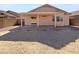 Backyard featuring a covered patio space perfect for entertaining, and dirt yard at 1595 S 227Th Ave, Buckeye, AZ 85326