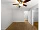 Neutrally painted bedroom, ceiling fan, and closet entrance at 1595 S 227Th Ave, Buckeye, AZ 85326