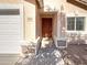 Inviting front door with stone accents and a well-maintained facade, adding curb appeal to this lovely home at 1595 S 227Th Ave, Buckeye, AZ 85326