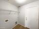 Convenient laundry room with a door to the exterior at 1595 S 227Th Ave, Buckeye, AZ 85326