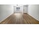 Spacious living room with a large window and light wood flooring at 1595 S 227Th Ave, Buckeye, AZ 85326