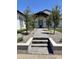 Inviting home entrance with well-maintained landscaping, stone pathway, and modern architectural details at 1650 W Lucky Ln, Queen Creek, AZ 85144