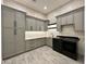 Well-organized laundry room with ample storage and gray custom cabinetry at 1650 W Lucky Ln, Queen Creek, AZ 85144