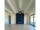 Open-concept living room with a modern fireplace and coffered ceilings at 1650 W Lucky Ln, Queen Creek, AZ 85144