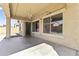 Back patio with modern chandelier and windows looking into the house, seamlessly connecting indoor and outdoor spaces at 16762 W Sonora St, Goodyear, AZ 85338