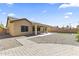Spacious backyard with a covered patio, well maintained gravel and a custom brick patio design at 16762 W Sonora St, Goodyear, AZ 85338
