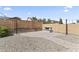 Backyard featuring a built-in firepit and string lights, offering a cozy ambiance for outdoor entertaining at 16762 W Sonora St, Goodyear, AZ 85338