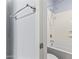 Bright bathroom featuring a shower-tub combo with white tile surround at 16762 W Sonora St, Goodyear, AZ 85338