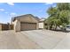Charming single-story home with a two-car garage and a well-maintained landscaped front yard at 16762 W Sonora St, Goodyear, AZ 85338