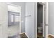 Hallway view leading to a carpeted room, showcasing the home's spaciousness and seamless flow at 16762 W Sonora St, Goodyear, AZ 85338