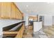 Bright kitchen features stainless steel appliances, stone tile flooring, and granite countertops at 16762 W Sonora St, Goodyear, AZ 85338