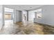 Spacious open-concept living room with tile floors, neutral walls, and ample natural light at 16762 W Sonora St, Goodyear, AZ 85338