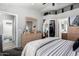 Bedroom with carpeted floors and access to bathroom and walk-in closet at 16821 S 23Rd St, Phoenix, AZ 85048