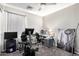 Functional bedroom featuring a TV, stationary bike and work desk at 16821 S 23Rd St, Phoenix, AZ 85048