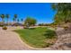 Scenic community green with lush lawn, mature trees, and desert landscaping in a well-maintained neighborhood at 16821 S 23Rd St, Phoenix, AZ 85048