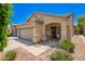 Inviting single-story home with a two-car garage, covered porch, and low-maintenance landscaping at 16821 S 23Rd St, Phoenix, AZ 85048