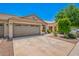 Attractive single-story home boasts a two-car garage, xeriscaped yard, and a welcoming covered porch at 16821 S 23Rd St, Phoenix, AZ 85048