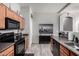 Modern kitchen with wood cabinets and stainless steel appliances at 16821 S 23Rd St, Phoenix, AZ 85048