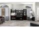 Stylish entertainment center in the living room with a built-in display, a workspace, and natural light at 16821 S 23Rd St, Phoenix, AZ 85048