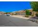 Wide street view of a neighborhood showcasing well-maintained homes with xeriscaped front yards at 16821 S 23Rd St, Phoenix, AZ 85048