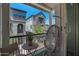 Charming balcony with outdoor seating and neighborhood views of upscale homes and landscaping at 1694 E Dogwood Ln, Gilbert, AZ 85295