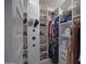 Well-organized walk-in closet with ample shelving and hanging space for clothes and accessories at 1694 E Dogwood Ln, Gilbert, AZ 85295