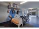 A well-organized garage with ample storage, epoxy floor, and room for bikes and other recreational equipment at 1694 E Dogwood Ln, Gilbert, AZ 85295